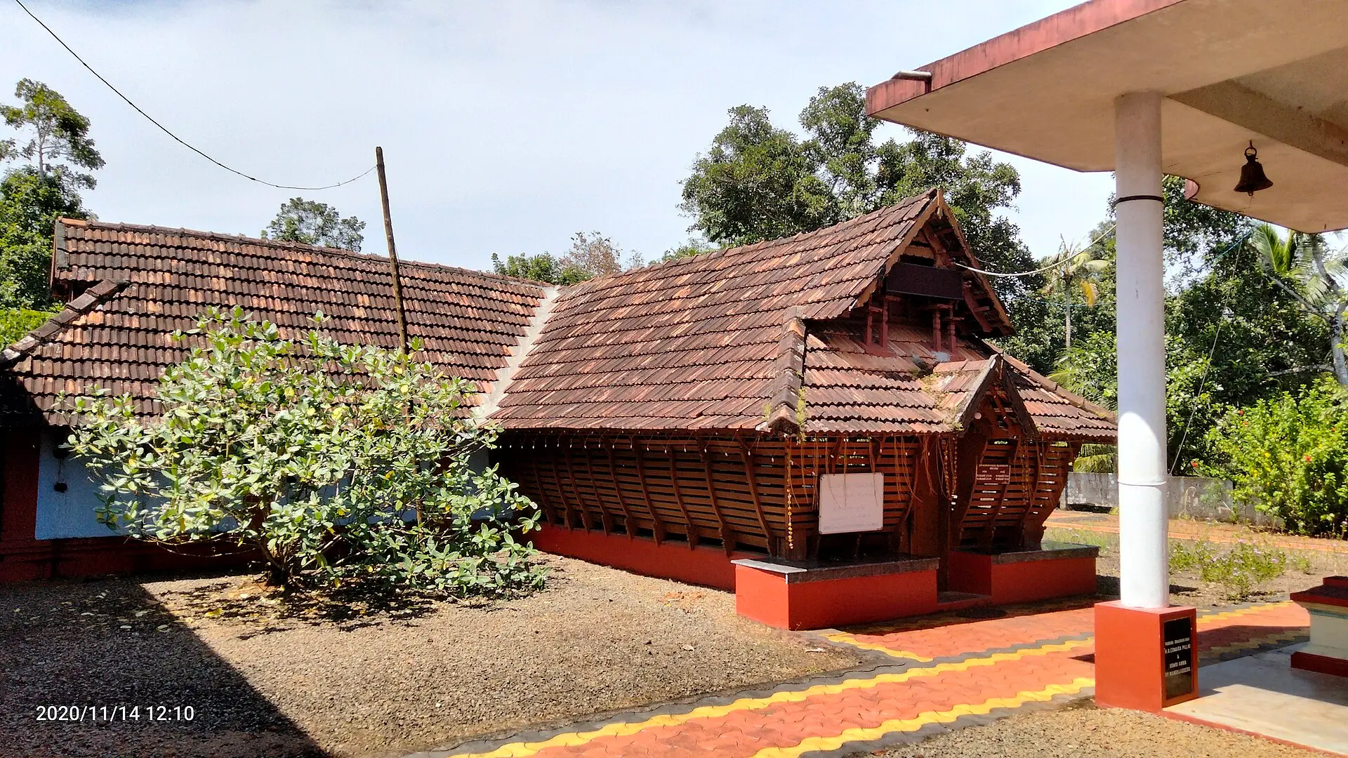 Wooden temple roof with terracotta tiles near Kottayam, Kerala